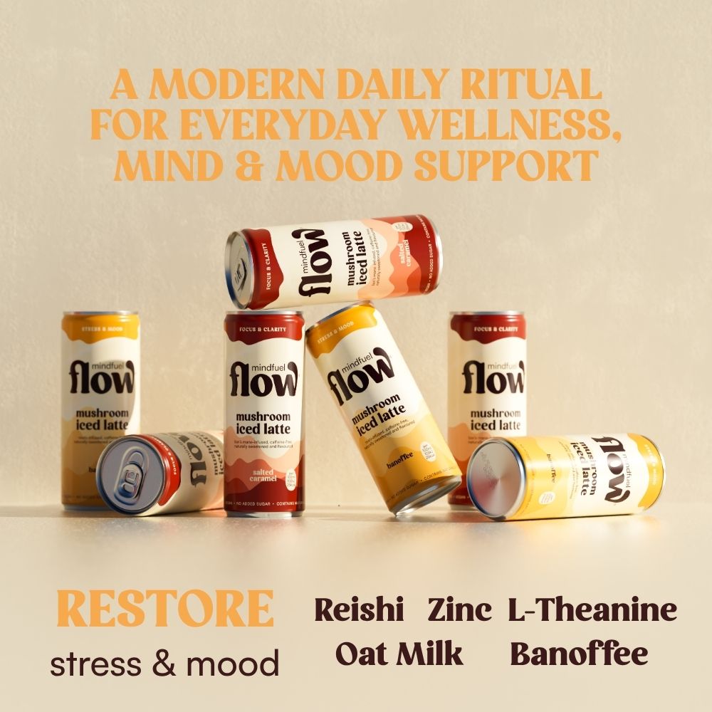 Reishi oat latte in a glass cup with Banoffee flavor by MINDFUEL FLOW, showcasing a creamy drink with a smooth texture.